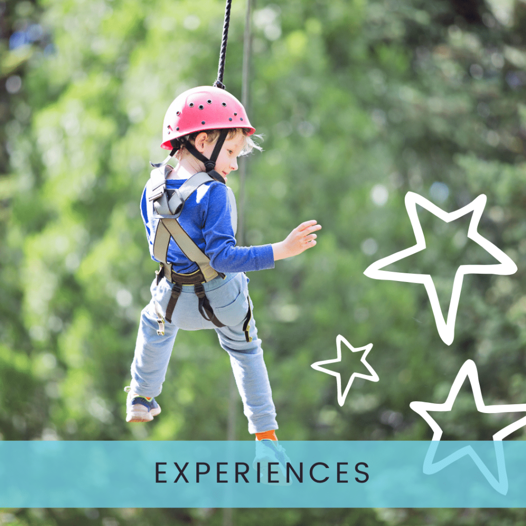 Boy riding zip line in harness