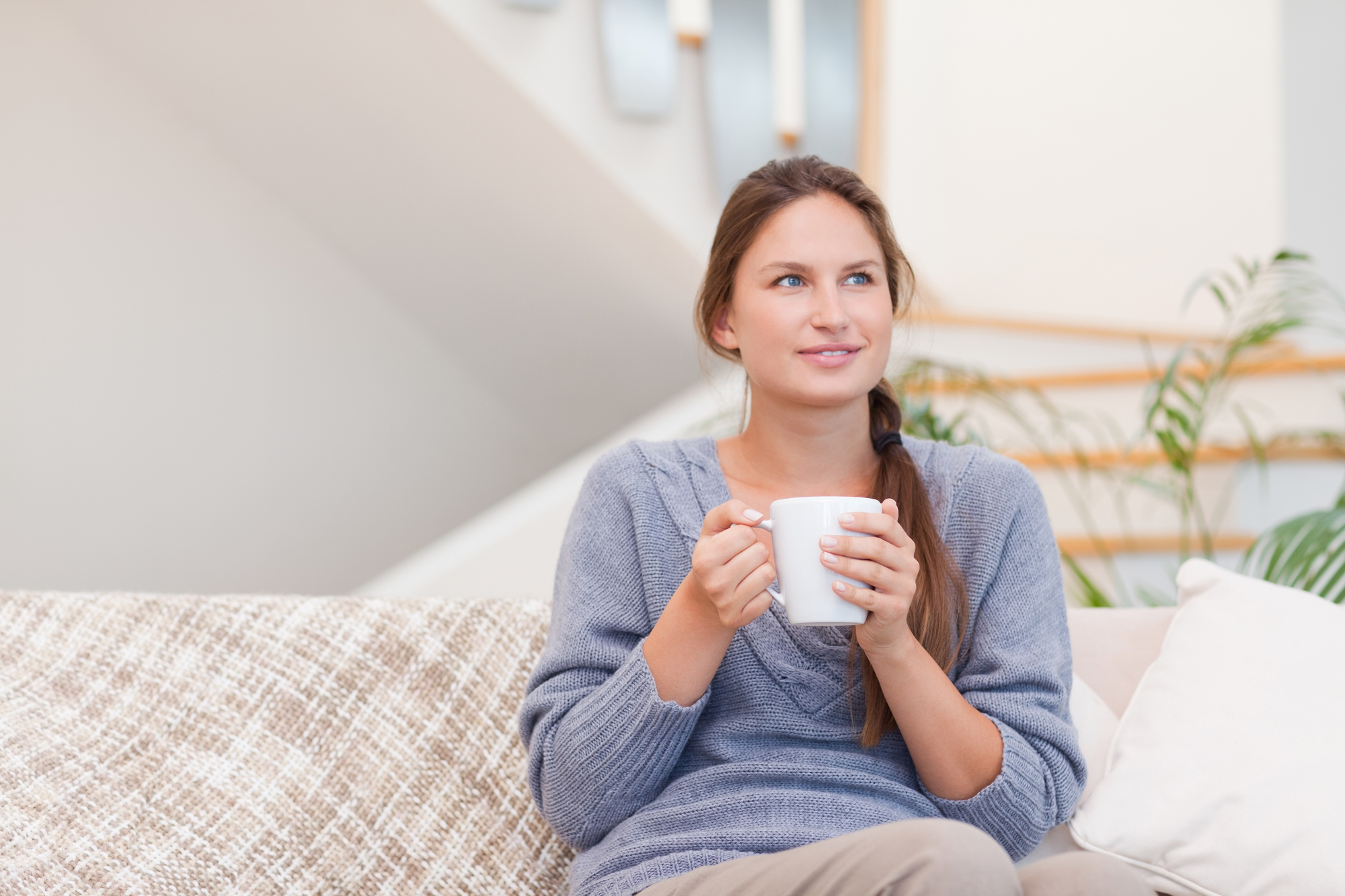 relaxed woman holding coffee cup