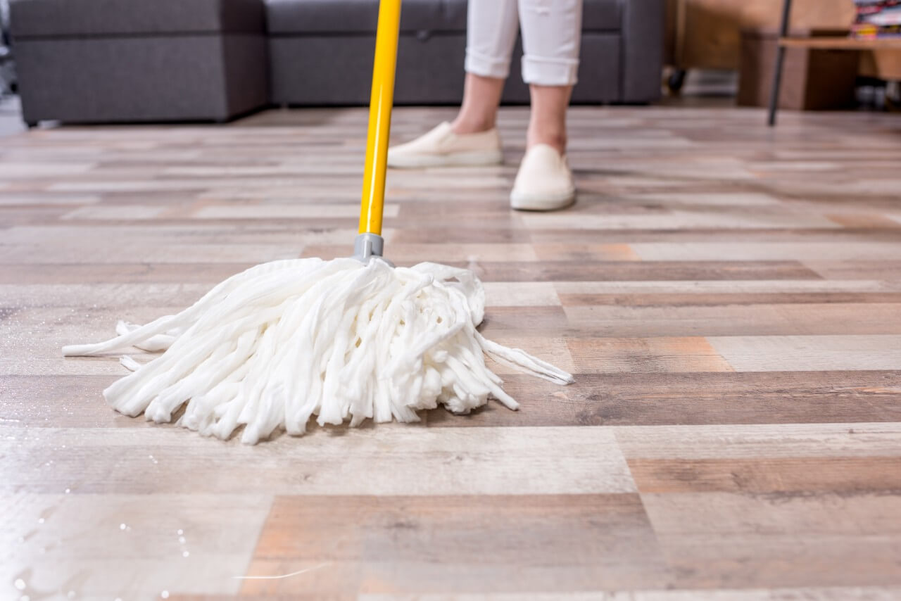 woman mopping floor