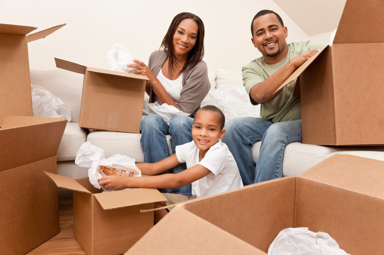 Family with moving boxes