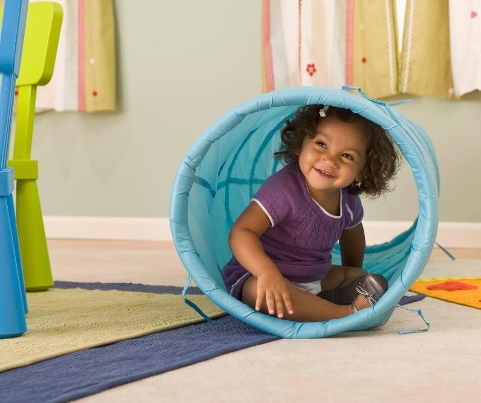 girl in collapsible play tunnel