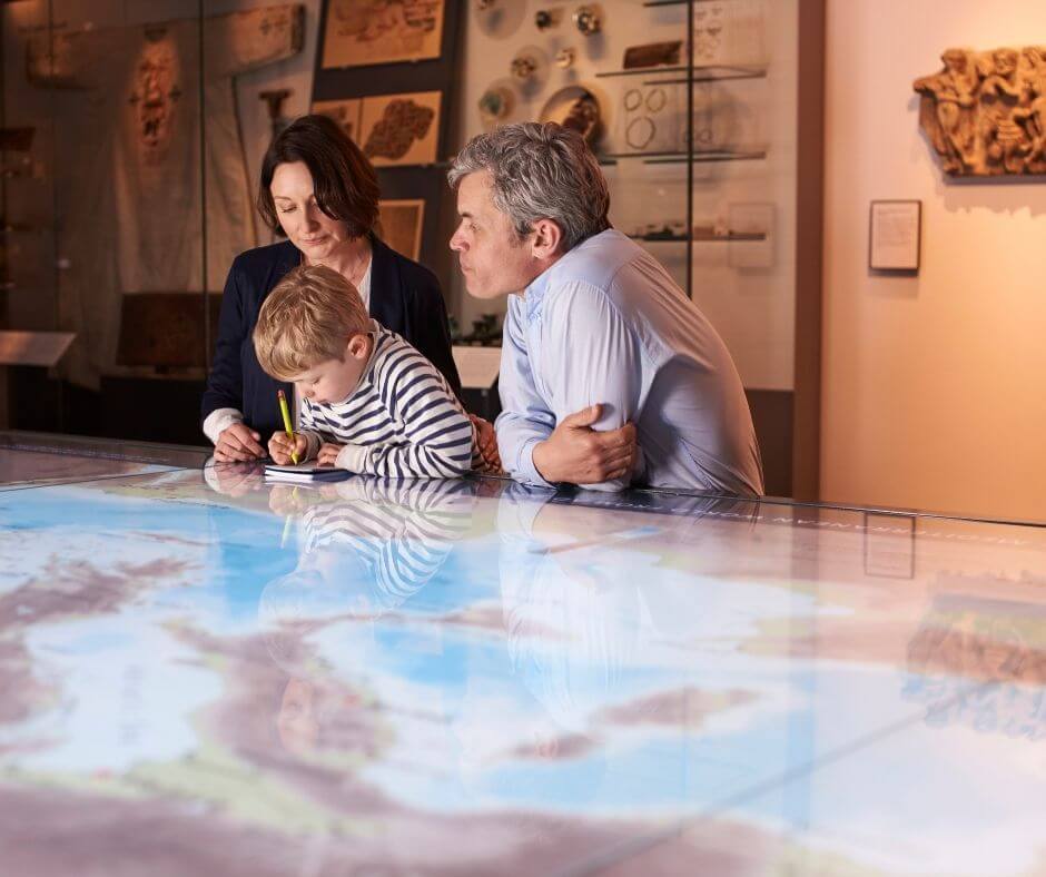 grandparents with grandson at a museum