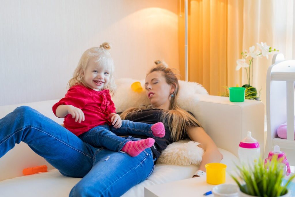 Mom who doesn't feel like cleaning and is sleeping on couch.