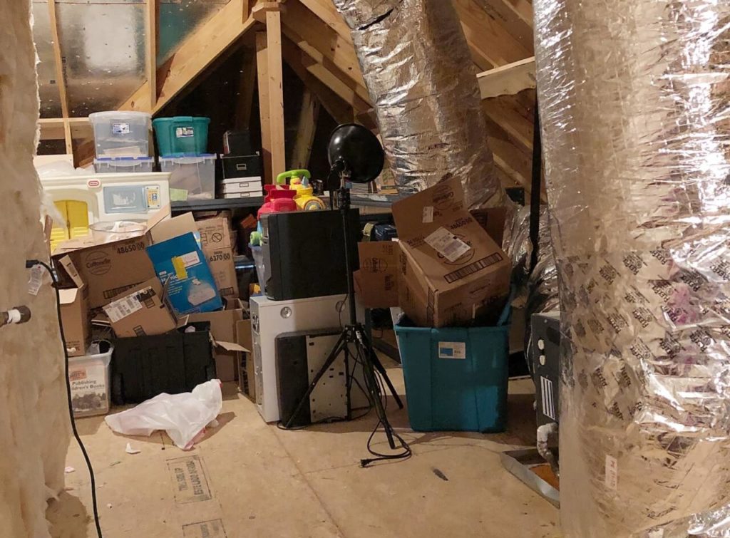 a path through the clutter in the attic