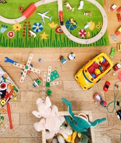 messy kid's toys in room - declutter toys