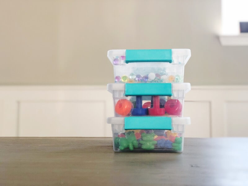 Sterilite clear storage bins with educational toys inside