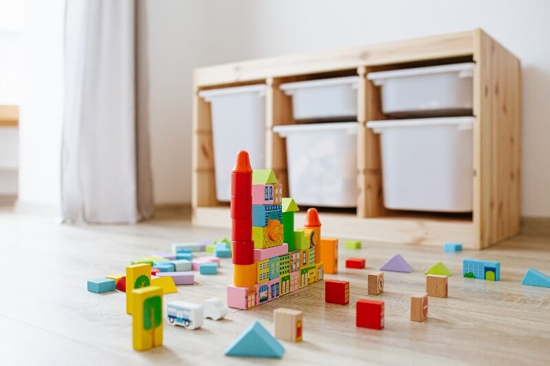 IKEA Trofast storage in background, with building blocks in foreground