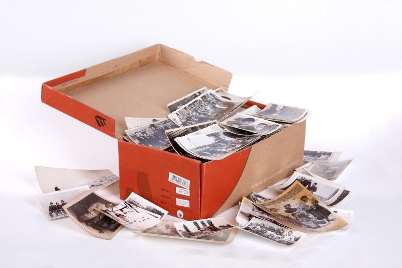Shoe box full of old photographs